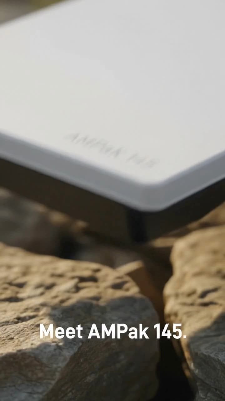 A 19-second demo for a portable power base that a satellite internet dish sits on, shown on a mountain ridge, at a campsite and in the back of a van.